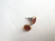 Load image into Gallery viewer, Small Orange Glass Stud Earrings Gold Rimmed Orange Vintage Glass Cabochon Earrings, Oval Glass Studs with golden rims, Mod Earrings Posts