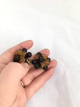 Load image into Gallery viewer, Big Plastic Clip on Earrings ROCHELLE Chrysanthemum Style Earrings in Golden Orange and Black