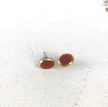 Load image into Gallery viewer, Small Orange Glass Stud Earrings Gold Rimmed Orange Vintage Glass Cabochon Earrings, Oval Glass Studs with golden rims, Mod Earrings Posts