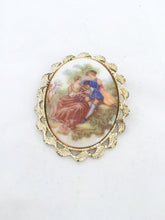 Load image into Gallery viewer, Cabochon Cameo brooch Lovers Cameo French Plastic Cameo marked Fragonard. Lovers Scene Cameo in gold tone setting
