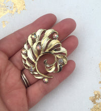 Load image into Gallery viewer, Vintage Gold Swirl Brooch with Aurora Borealis Rhinestones, Vintage Gold Rhinestone Brooch
